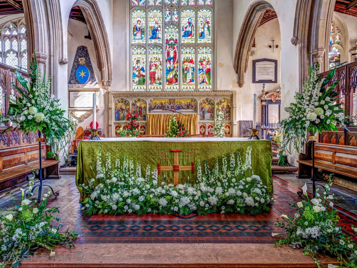 A church with flowers and a table

Description automatically generated with medium confidence